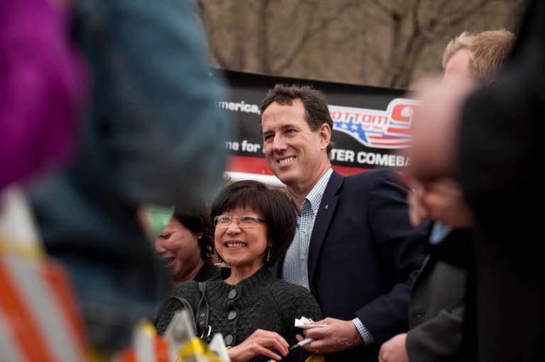 Santorum takes Kansas, Romney counters in Wyoming