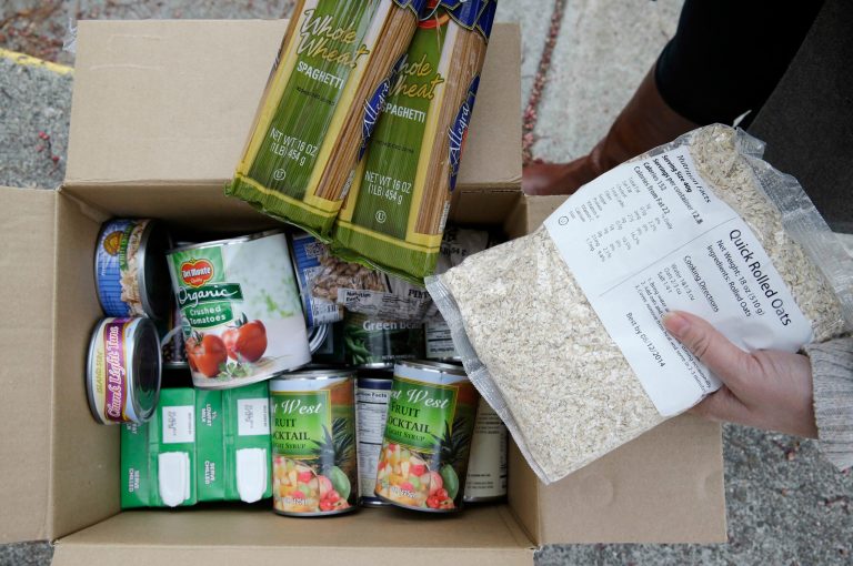 Kansas and Maine's experiences indicate that a large number of able-bodied, childless recipients were happy to collect food benefits while they could do so without any obligation. (AP Photo)