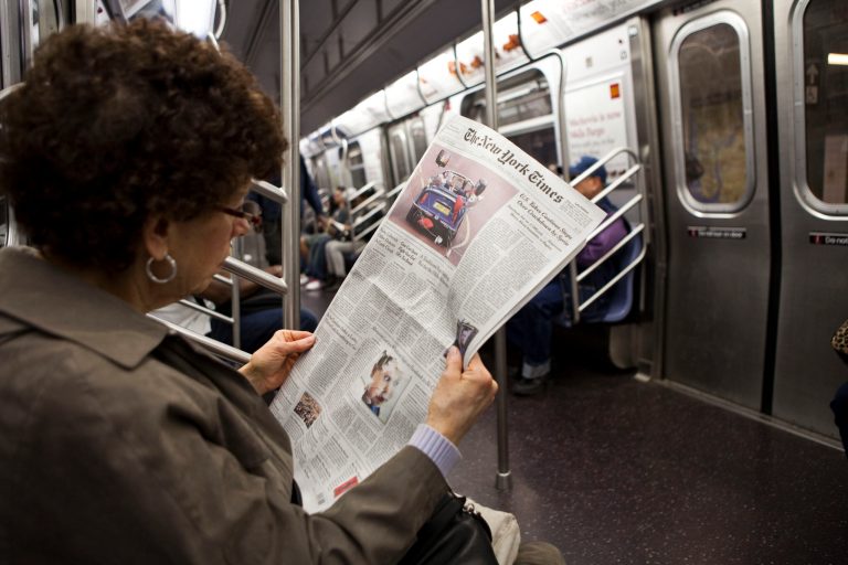 A woman reads about the royal wedding of TRH Prince William, Duke of Cambridge and Catherine, Duchess of Cambridge, in The New York Times newspaper on April 30, 2011 in New York City. (Photo by Ramin Talaie/Getty Images)
