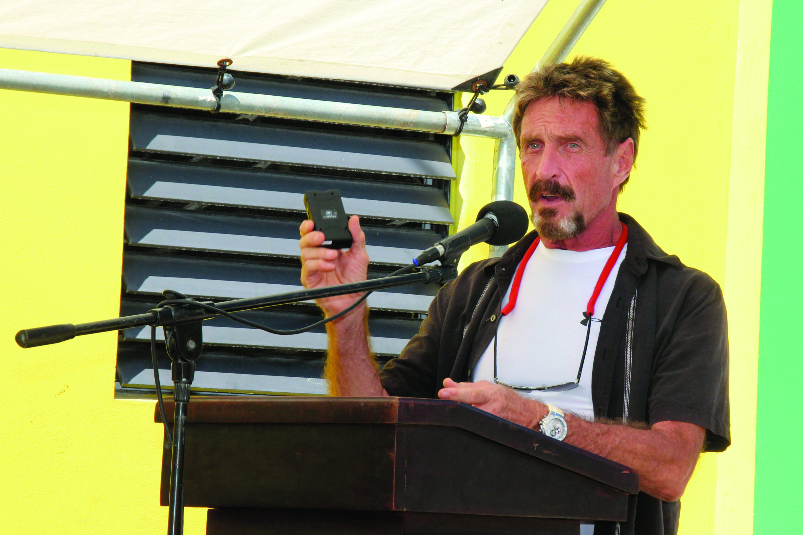 McAfee blogs about police seeking him in Belize