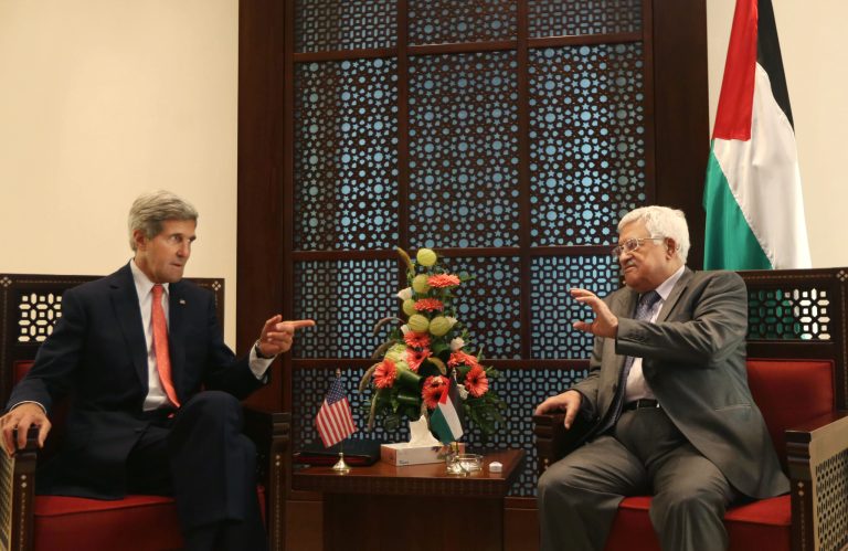 Secretary of State John Kerry, left, speaks with Palestinian President Mahmoud Abbas in the West Bank city of Bethlehem on Wednesday. (AP/Fadi Arouri)