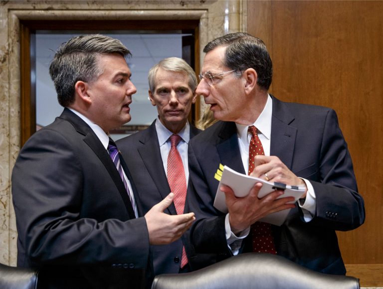 Senate Energy and Natural Resources Committee members, from left, Sen. Cory Gardner, R-Colo., Sen. Rob Portman, R-Ohio, and Sen. John Barrasso, R-Wyo., confer on Capitol Hill in Washington, Thursday, Jan. 8, 2015, as the committee crafts a markup of the long-stalled Keystone XL pipeline bill. (AP Photo/J. Scott Applewhite)