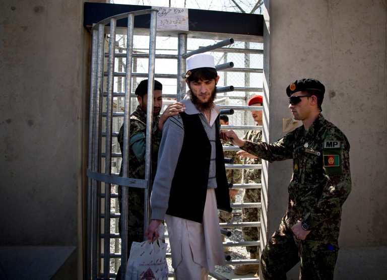 An Afghan prisoner leaves the Parwan Detention Facility after the U.S. military gave control of its last detention facility to Afghan authorities in Bagram, outside Kabul, Afghanistan, on March 25. (AP Photo/Anja Niedringhaus)