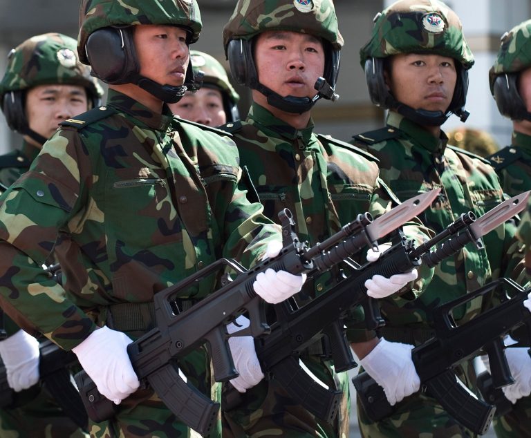 Soldiers from the People's Liberation Army (PLA) 6th Armored Division carries the Chinese type 97 semi-auto machine guns march at their military base on the outskirts of Beijing, Tuesday, March 31, 2009. A government-backed science group says many of China's homemade weapons systems are world-class, reflecting the defense industry's new confidence and underscoring its ambitions of becoming a major arms exporter. (AP Photo/Andy Wong)