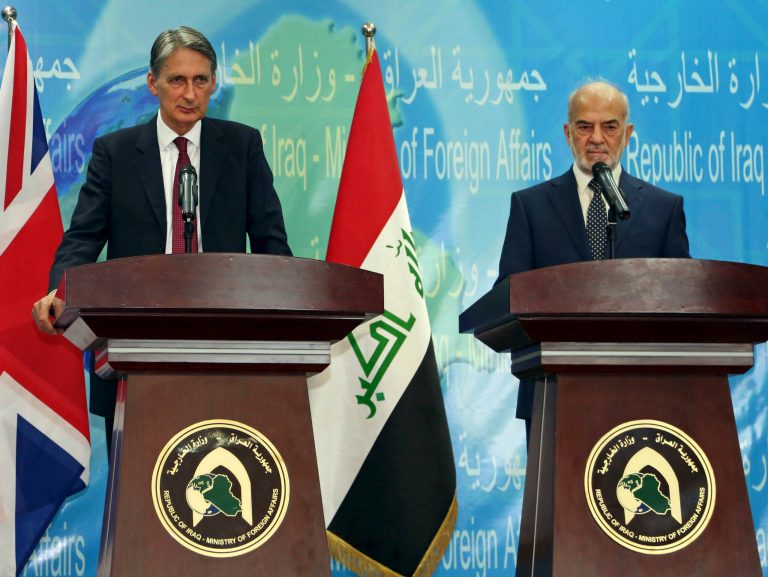 Britain's Foreign Secretary Philip Hammond, left, and his Iraqi counterpart Ibrahim al-Jaafari, give a news conference in Baghdad, Iraq, Monday, Oct. 13, 2014. Hammond says coalition airstrikes will not be enough to defeat the Islamic State group, saying that the Iraqi government, its military and its people play a key role in this fight. The British government is taking part in the U.S.-led aerial campaign combating the Islamic State group. However, it has refused to join the U.S.-led airstrike campaign in Syria. (AP Photo/Karim Kadim)