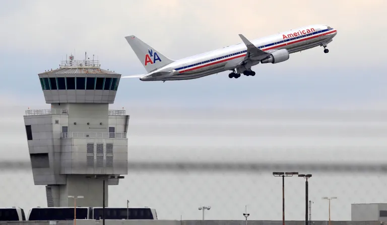 FILE - In this Friday, Oct. 14, 2011 photo, an American Airlines Boeing 767 takes off from Miami International Airport, in Miami. American Airlines Group Inc. releases quarterly financial results before the market opens on Thursday, April 24, 2014. (AP Photo/Wilfredo Lee, File)