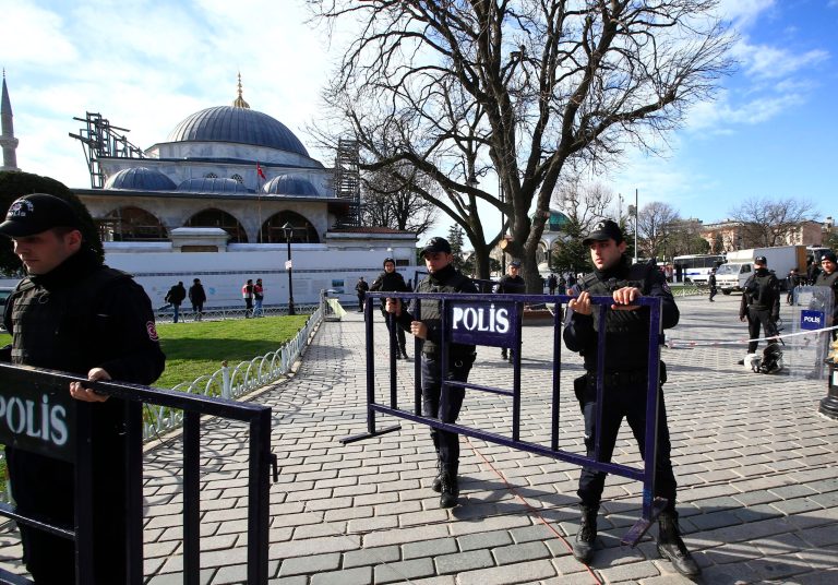 Police officers install security barriers at the historic Sultanahmet district after an explosion in Istanbul, Tuesday,. (AP Photo/Lefteris Pitarakis)