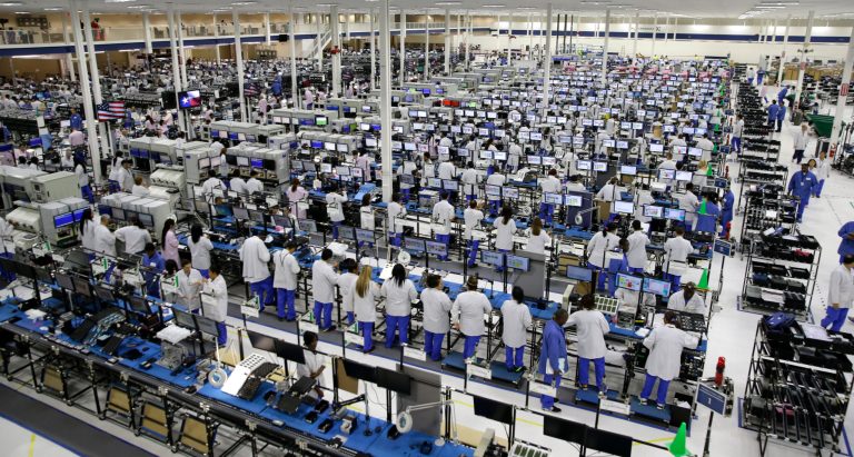 FILE -In this Tuesday, Sept. 10, 2013, file photo, workers man the Motorola smartphone plant in Fort Worth, Texas.  The Federal Reserve reports on industrial production for March later Wednesday April 16, 2014. (AP Photo/LM Otero, File)