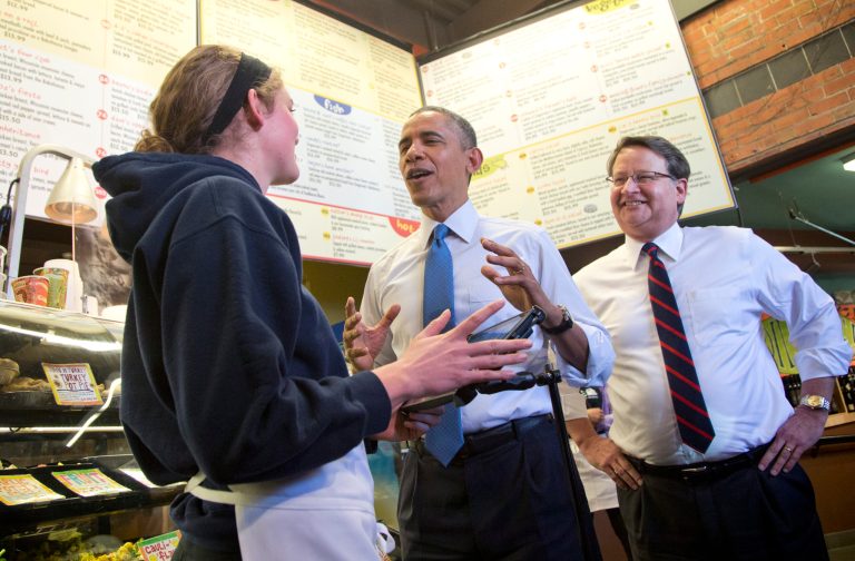 President Obama, accompanied by Senate candidate Gary Peters, talks with an employee at Zingerman's Deli in Ann Arbor, Mich., on Wednesday. (AP Photo/Carolyn Kaster)