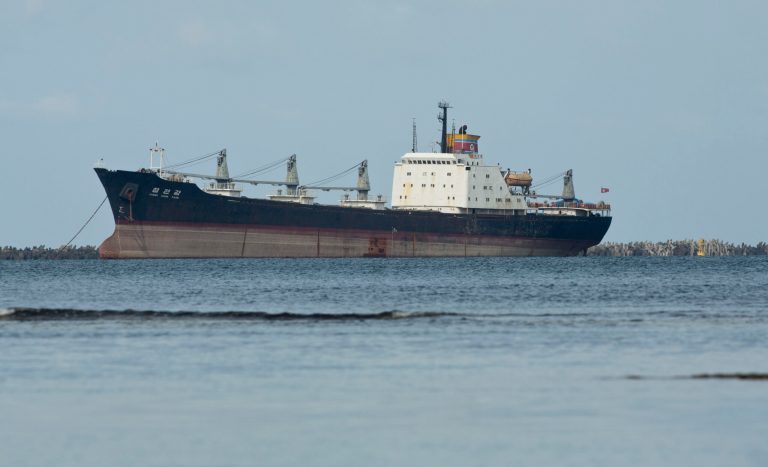 FILE - In this Nov. 27, 2013 file photo, the North Korean-flagged cargo ship Chong Chon Gang sits in Sherman Bay near Colon City, Panama. Panama Canal officials say on Saturday, Feb. 8, 2014 that the seized ship is free to leave because the owner has paid a fine. Three of the ship's operators still face charges, while 32 crew members are free to return to North Korea. The vessel was detained in July 2013 when a search revealed it was carrying weapons from Cuba. (AP Photo/Arnulfo Franco, File)