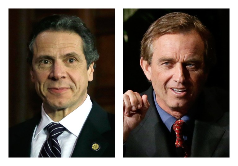 These 2013 file photos show New York Gov. Andrew Cuomo, left, in Albany, N.Y. and Robert F. Kennedy Jr. in Dallas, Texas. People familiar with Cuomo's thinking on fracking tell The Associated Press he was on the brink of approving the much-debated gas drilling method in February 2013 but held off after discussions with environmentalist and former brother-in-law, Kennedy. (AP Photo/Tony Gutierrez)