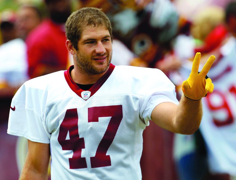 Carolyn Kaster/AP
Washington Redskins tight end Chris Cooley acknowledges fans during training camp at Redskins Park.