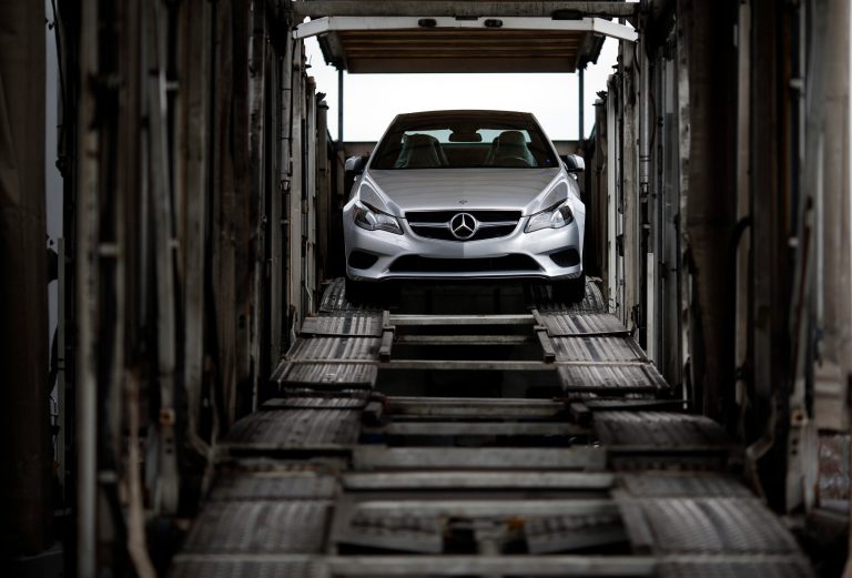 In this March 27, 2014 picture, a Mercedes-Benz vehicle sits inside a car-carrier before being hauled away for distribution from the company's Vehicle Processing Center in Baltimore. After sales slumped in January and February because of the brutal weather, automakers hope a rebound in March get them back on track to sell more than 16 million cars in the U.S. this year.  (AP Photo/Patrick Semansky)