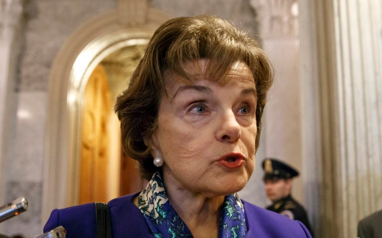 FILE - In this March 11, 2014, file photo, Senate Intelligence Committee Chair Sen. Dianne Feinstein, D-Calif. talks to reporters as she leaves the Senate chamber on Capitol Hill in Washington. Feinstein on Wednesday March 19, 2014, joined Gov. Jerry Brown in expressing skepticism about legalizing marijuana in California for recreational purposes.   (AP Photo/J. Scott Applewhite, File)