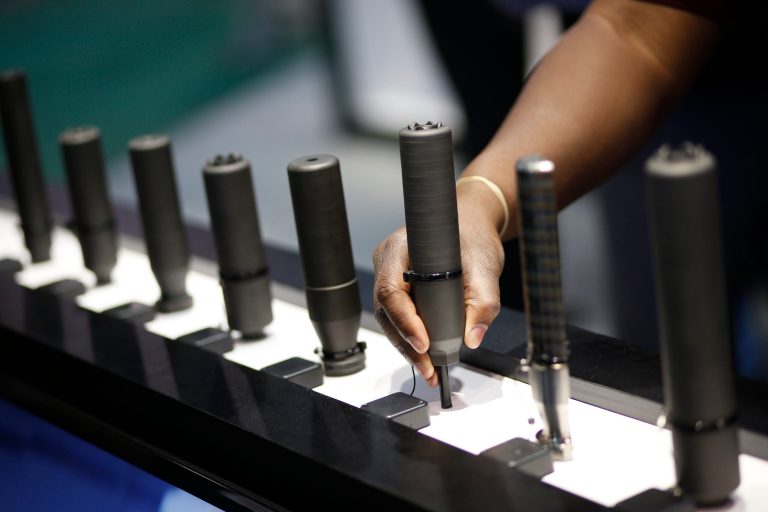 Silencers are on display at the Sig Sauer booth at the Shooting, Hunting and Outdoor Trade Show, Tuesday, Jan. 19, 2016, in Las Vegas. (AP Photo/John Locher)