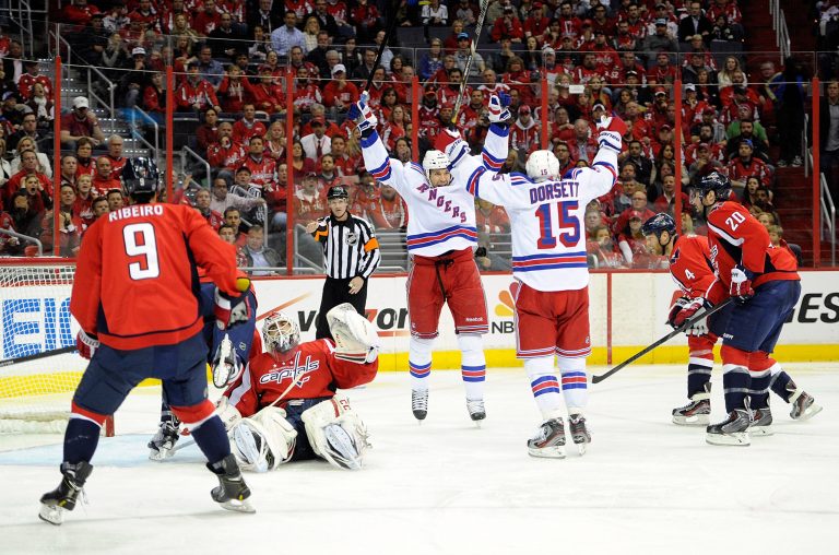 Greg Fiume/Getty Images
The Rangers' Taylor Pyatt and Derek Dorsett celebrate after Pyatt's second-period goal gave his team a 2-0 lead against the Capitals, a lead New York would never relinquish.