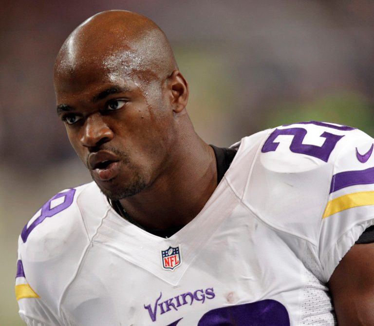 FILE - In this Sept. 7, 2014, file photo, Minnesota Vikings running back Adrian Peterson warms up for an NFL football game against the St. Louis Rams in St. Louis. The Vikings benched Peterson for Sunday's game after his attorney said he had been indicted by a Texas grand jury on a charge of child abuse. Attorney Rusty Hardin says the charge accuses Peterson of using a branch, or switch, to spank his son. He says Peterson has cooperated with authorities and 