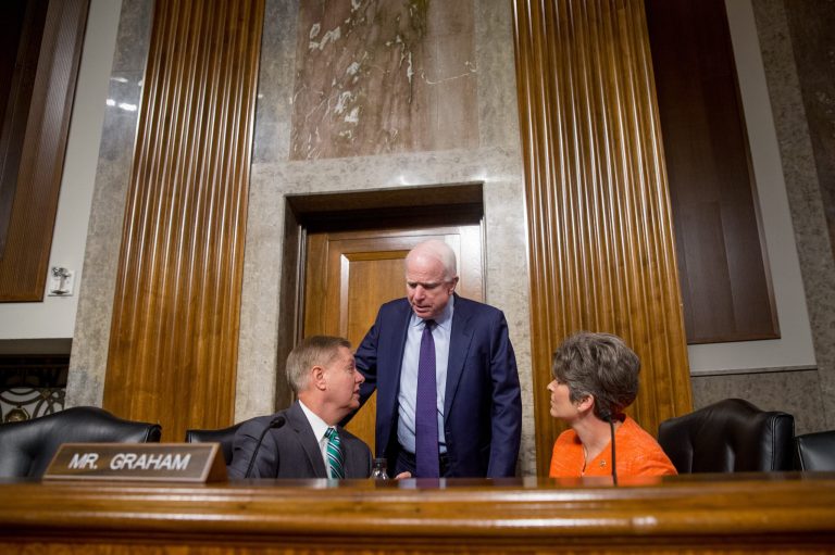 Senate Armed Services Committee Chairman Sen. John McCain, center, talks with committee members Sen. Lindsey Graham, R-S.C., and Sen. Joni Ernst, R-Iowa, on Capitol Hill in Washington, Wednesday. (AP Photo/Andrew Harnik)