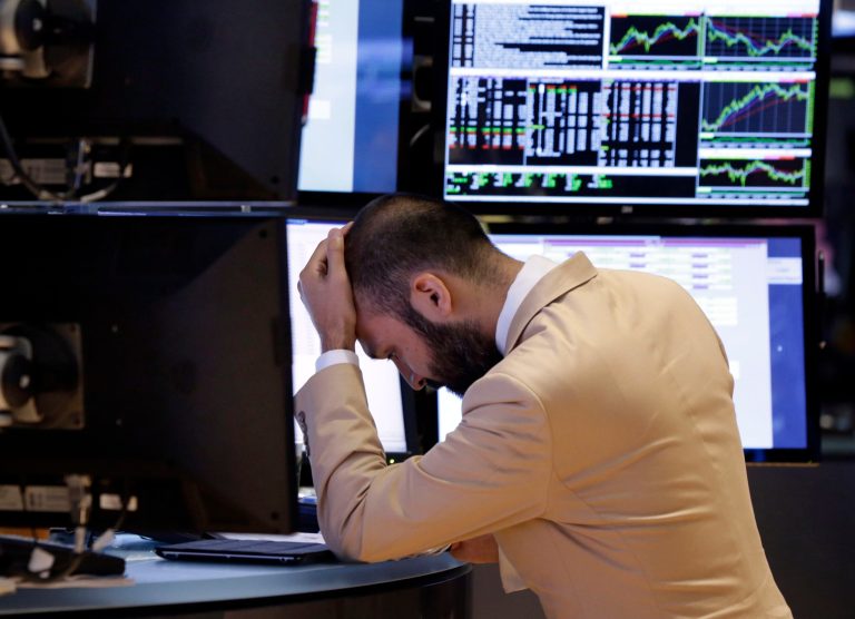 A specialist works on the floor of the New York Stock Exchange on Monday. (AP/Richard Drew)