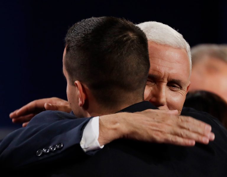 Republican vice-presidential nominee Gov. Mike Pence hugs his son Michael following the vice-presidential debate with Democratic vice-presidential nominee Sen. Tim Kaine at Longwood University in Farmville, Va., Tuesday, Oct. 4, 2016. (AP Photo/Patrick Semansky)