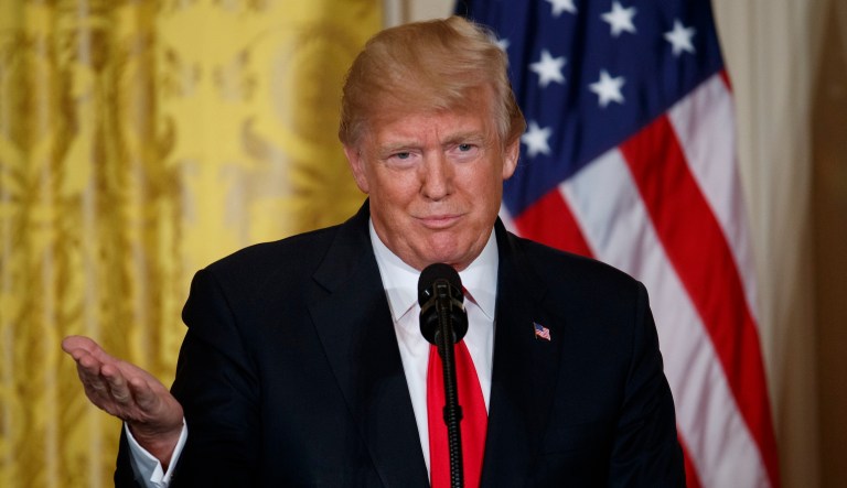 While President Trump's remarks about immigrants from Haiti and El Salvador were making headlines Thursday, the details of a bipartisan immigration fix that would codify Deferred Action for Childhood Arrivals were leaked. (AP Photo/Evan Vucci)