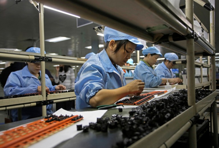 Megan McArdle cites a paper by three eminent economists which suggests that opening American markets to trade with China was a bad idea. (AP file photo/Vincent Yu)