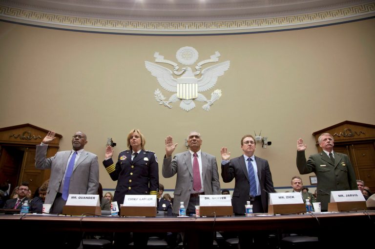 From left, DC Deputy Mayor for Public Safety and Justice Paul Quander, DC Police Chief Cathy Lanier, DC Department of Health Director Mohammed Akhter, William and Mary law professor Timothy Zick, and National Park Service Director Jonathan Jarvis are sworn in on Capitol Hill in Washington, Tuesday, Jan. 24, 2012, prior to testifying before the House Oversight and Government Reform Committee hearing on the McPherson Square campsite as part of the ongoing Occupy DC protest.