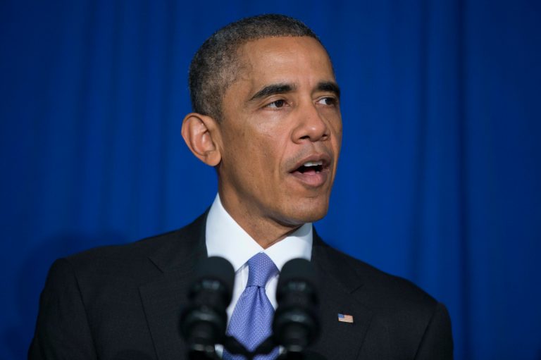 President Barack Obama delivers remarks at the Consumer Financial Protection Bureau, on Friday, Oct. 17, 2014, in Washington. Obama signed an executive order to improve security measures for government credit and debit cards. (AP Photo/Evan Vucci)