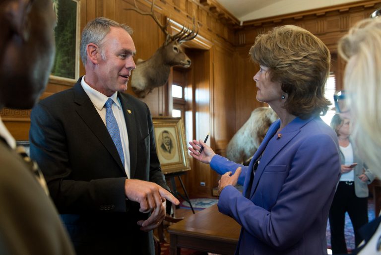 Interior Secretary Ryan Zinke, left, speaks with Sen. Lisa Murkowski, R-Alaska in his Interior Department office. (AP Photo/Molly Riley)