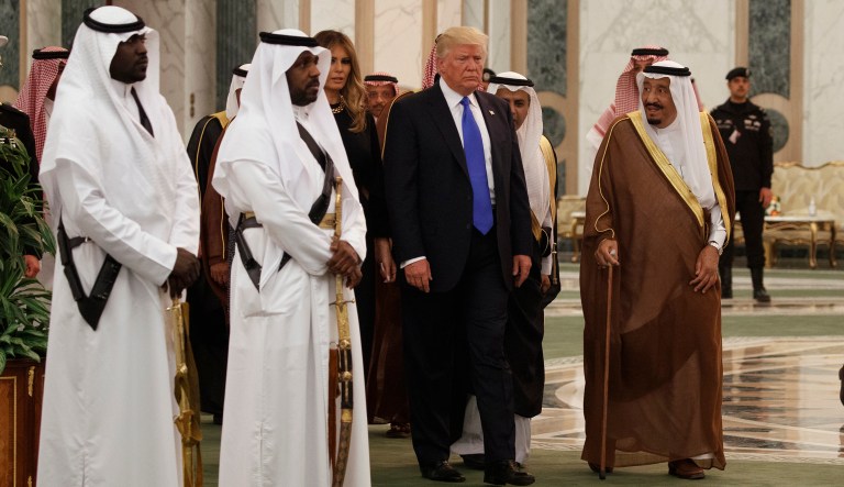 President Donald Trump and first lady Melania Trump walk with Saudi King Salman to a coffee ceremony and presentation ceremony of the Collar of Abdulaziz Al Saud Medal at the Royal Court Palace, Saturday, May 20, 2017, in Riyadh. (AP Photo/Evan Vucci)