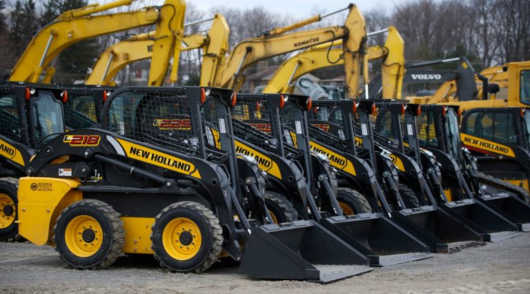 In this Friday, March 28, 2014 photo, earth-moving and construction equipment is stored on a lot at the Highway Equipment Company in Zelienople, Pa. The Commerce Department releases business inventories for March on Tuesday, May 13, 2014. (AP Photo/Keith Srakocic)
