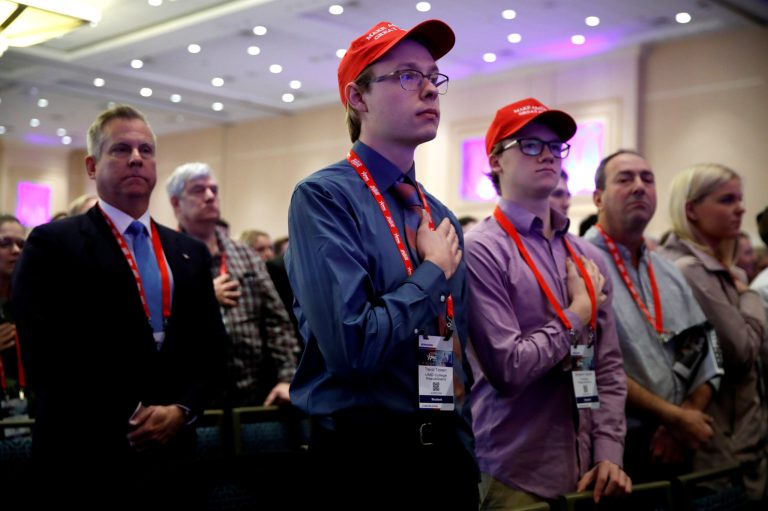 Trevor Tovsen, center, with the University of Maryland College Republicans, says the Pledge of Allegiance, during the Conservative Political Action Conference (CPAC), at National Harbor, Md., Friday, Feb. 23, 2018, where President Donald Trump is expected to speak. (AP Photo/Jacquelyn Martin)