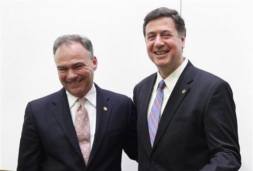 Former Virginia Gov. Tim Kaine, left, and Former Senator George Allen, right, greet each other after the AP Day at the Capitol Senatorial debate at the Capitol in Richmond, Va., Dec. 7, 2011.