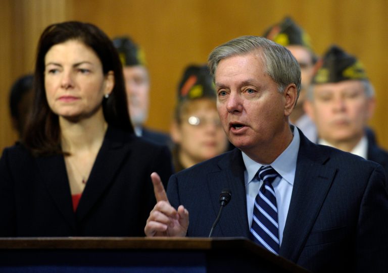 Sen. Lindsey Graham, R-S.C., right, accompanied by Sen. Kelly Ayotte, R-N.H., speaks during a news conference on Capitol Hill in Washington, Tuesday, Dec. 17, 2013, urging their Senate colleagues to change the budget proposal that cuts retirement benefits for current and future military retirees. (AP Photo/Susan Walsh)