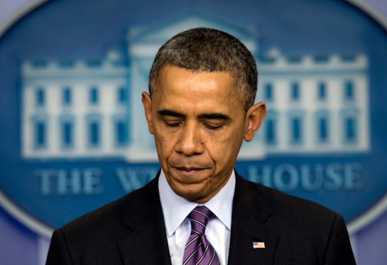 President Barack Obama pauses as he speaks in the briefing room of the White House in Washington, Thursday, Dec. 5, 2013, about the death of Nelson Mandela. Obama says the world has lost an influential, courageous and 'profoundly good' man with the death of anti-apartheid icon Mandela. (AP Photo/Carolyn Kaster)