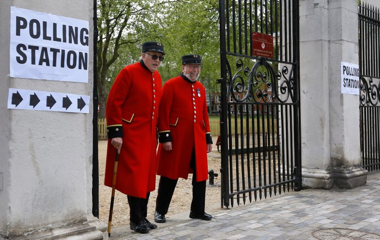 Chelsea Pensioners smile as they see the media after voting at a polling station in London, Thursday, May 7, 2015. (AP)