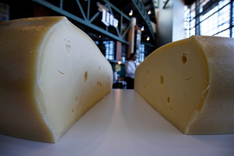 Cheese will now join the cow and milk as official state symbols listed in Wisconsin's Blue Book, in accordance with Wisconsin law. (AP Photo/Carrie Antlfinger, File)