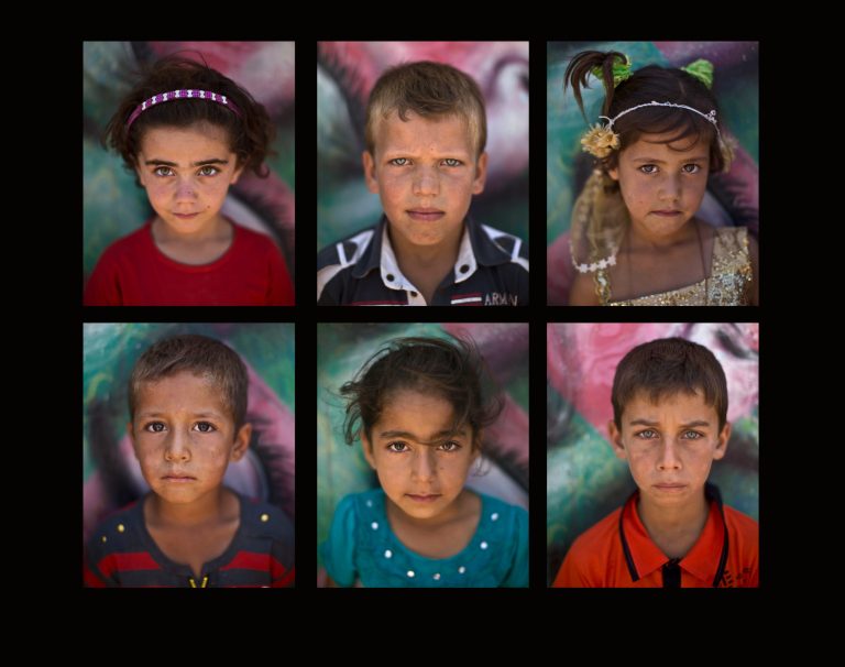 AP PHOTOS: Face of Syrian war seen in youngest