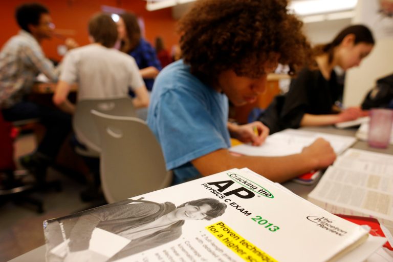An AP exam score high enough to earn college credit increases the probability of a given student finishing a bachelor's degree within four years by one to two percentage points per exam, according to the paper. (AP Photo)Â 
