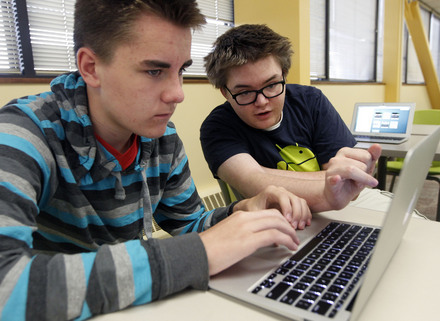 Al Hartmann  |  The Salt Lake Tribune
Tevis Hadley, left, sets up his face time and email accounts with some help from Arthur Tucker at Kaysville charter school Career Path High Tuesday September 10. Both are juniors at the school.  All 175 students were assigned an Apple laptop for the school year.