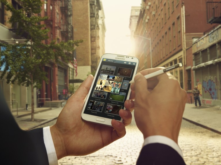   This undated image provided by Samsung shows the company's Note II phone. Over the past few years, smartphones have gradually gotten bigger and tablet computers have gotten smaller. So it should come as no surprise that devices in between are starting to emerge. These devices, informally known as phablets, are better described as giant phones than baby tablets, as they can be used for phone calls. And for now, they are closer in size to regular phones, with screens running 5 inches or more diagonally.. (AP Photo/HTC)  