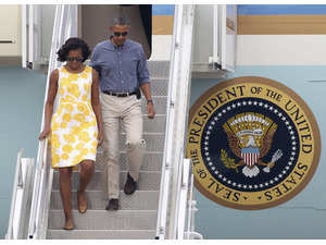 The Obama's arrive in Martha's Vineyard, Mass., for last year's summer vacation. AP Photo