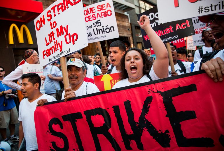 Approximately 20-30 protesters were arrested in New York. Protests demanding higher wages are planned in more than 100 cities throughout the U.S. today (Getty images/Andrew Burton)
