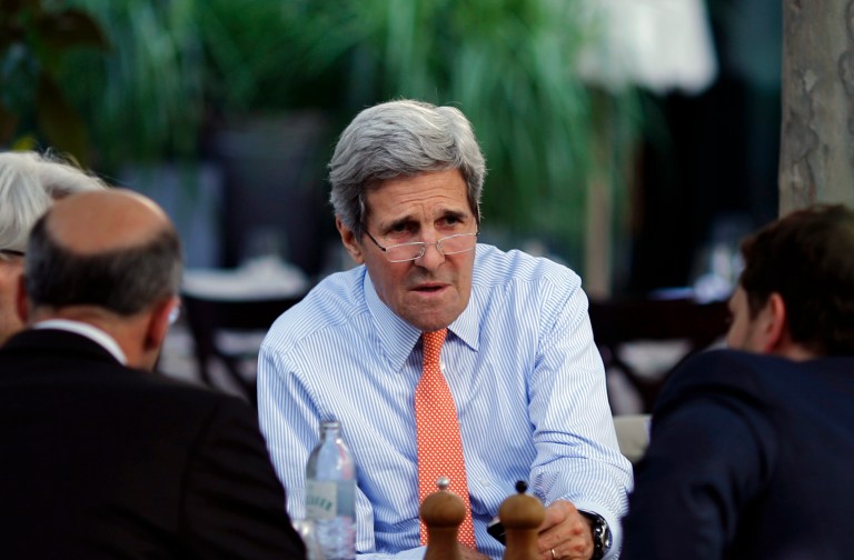 U.S. Secretary of State John Kerry, U.S. Under Secretary for Political Affairs Wendy Sherman, second from left,, National Security Council point person on the Middle East Robert Malley and Chief of Staff Jon Finer, right, meet on the terrace of a hotel where the Iran nuclear talks meetings are being held in Vienna, Austria, Thursday, July 2, 2015. (Carlos Barria/Pool via AP)