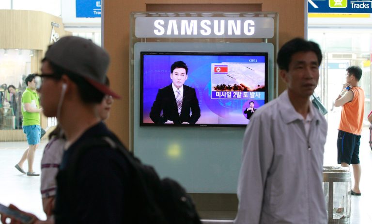 A TV news program reports missiles launch conducted by North Korea at Seoul Railway Station in Seoul, South Korea, Sunday, July 13, 2014.  North Korea launched two projectiles presumed to be ballistic missiles into the sea on Sunday, South Korea said, the latest in a series of test-firings seen as expressions of anger over its failure to win talks on receiving outside aid, and over ongoing U.S.-South Korean military drills. The letters at a screen read 