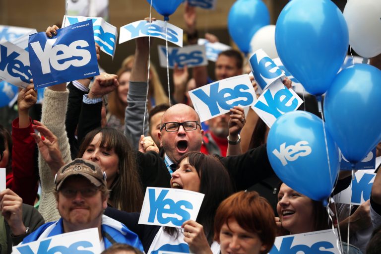 People attend a pro Scottish independence campaign rally, in central Glasgow, Scotland,Wednesday, Sept. 17, 2014. (AP Photo/David Cheskin)