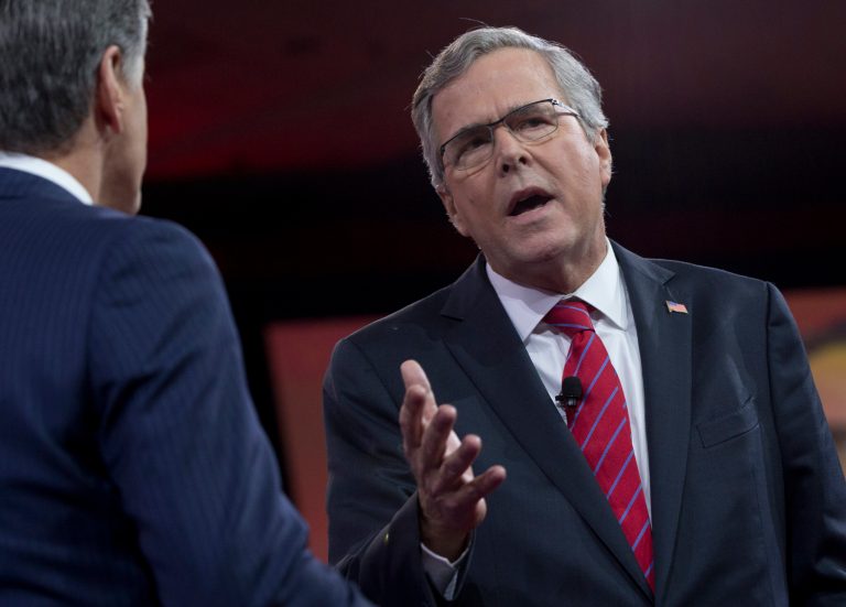 Former Florida Gov. Jeb Bush speaks with Sean Hannity of Fox News during the Conservative Political Action Conference (CPAC) in National Harbor, Md., Friday, Feb. 27, 2015. (AP Photo/Carolyn Kaster)