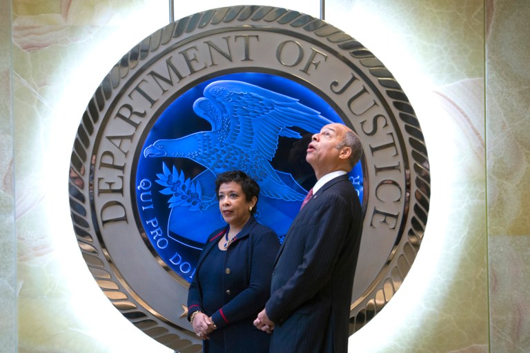 Homeland Security Secretary Jeh Johnson looks up as he and Attorney General Loretta Lynch, left, wait for the arrival of Chinese Minister of Public Security Guo Shengkun to discuss cybercrime and related issues. (AP Photo/Cliff Owen)