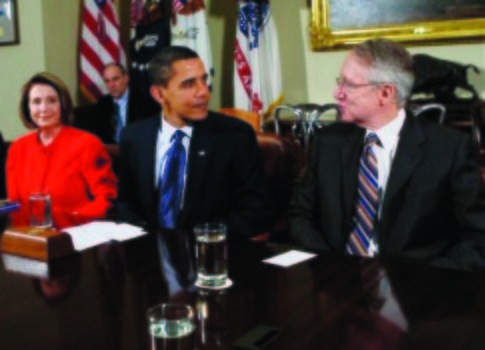 President Barack Obama has a word with Senate Majority Leader Harry Reid and House Minority Leader  Nancy Pelosi. (AP Photo/Charles Dharapak)