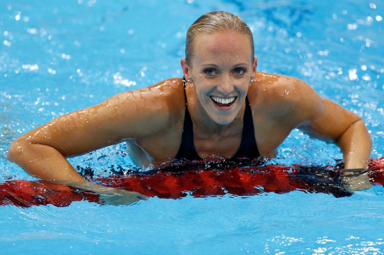 United States' Dana Vollmer reacts to her gold medal win in the he women's 100-meter butterfly swimming final at the Aquatics Centre in the Olympic Park during the 2012 Summer Olympics in London, Sunday, July 29, 2012. (AP Photo/Daniel Ochoa De Olza)